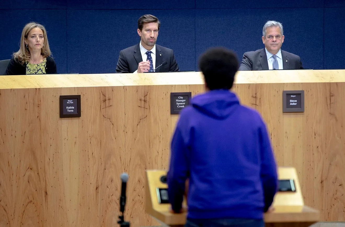City Council Member Kathie Tovo, left, City Manager Spencer Cronk, and Mayor Steve Adler listen to citizen comments during an Austin City Council meeting in 2018.